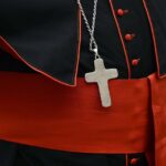 Pope Francis strips conservative US cardinal of some privileges, Vatican official says